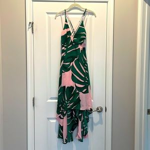 Gorgeous print dress. Cross tie back detail. High low back with lining in dress